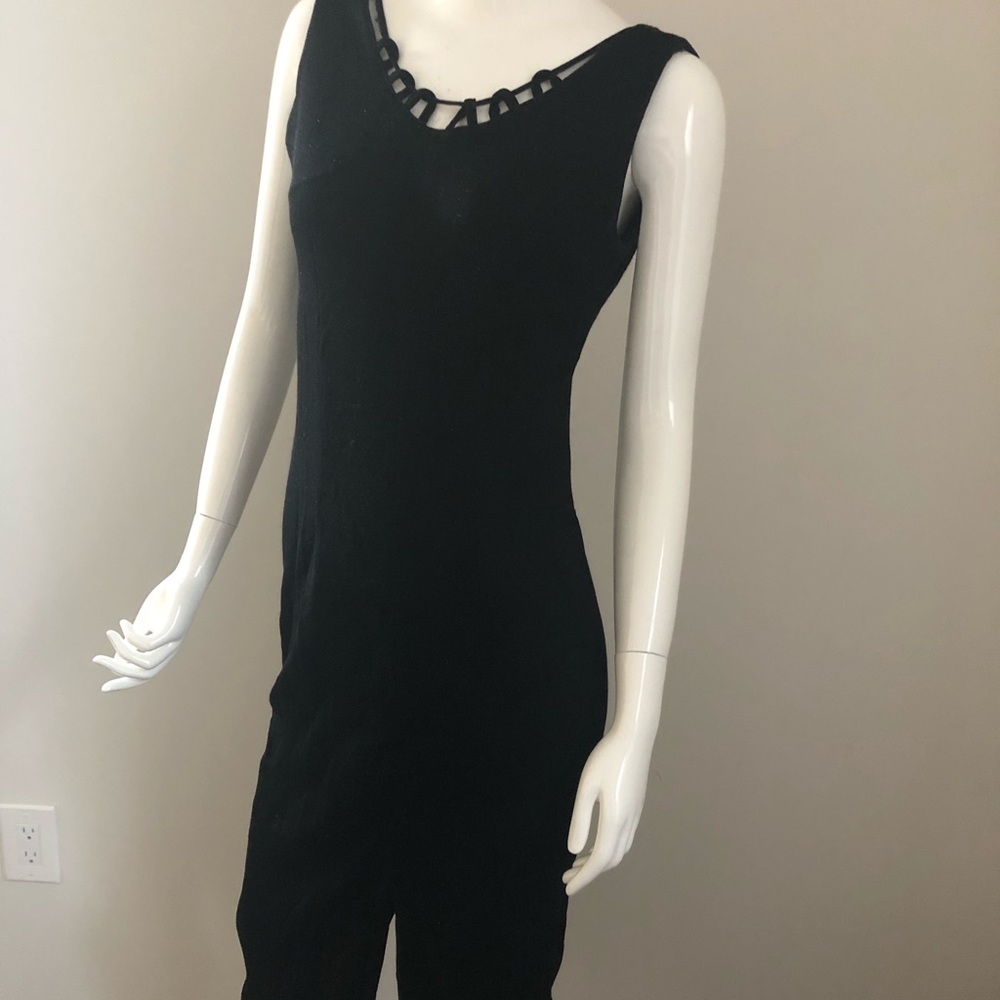 Woman’s black sleeveless dress with jacket